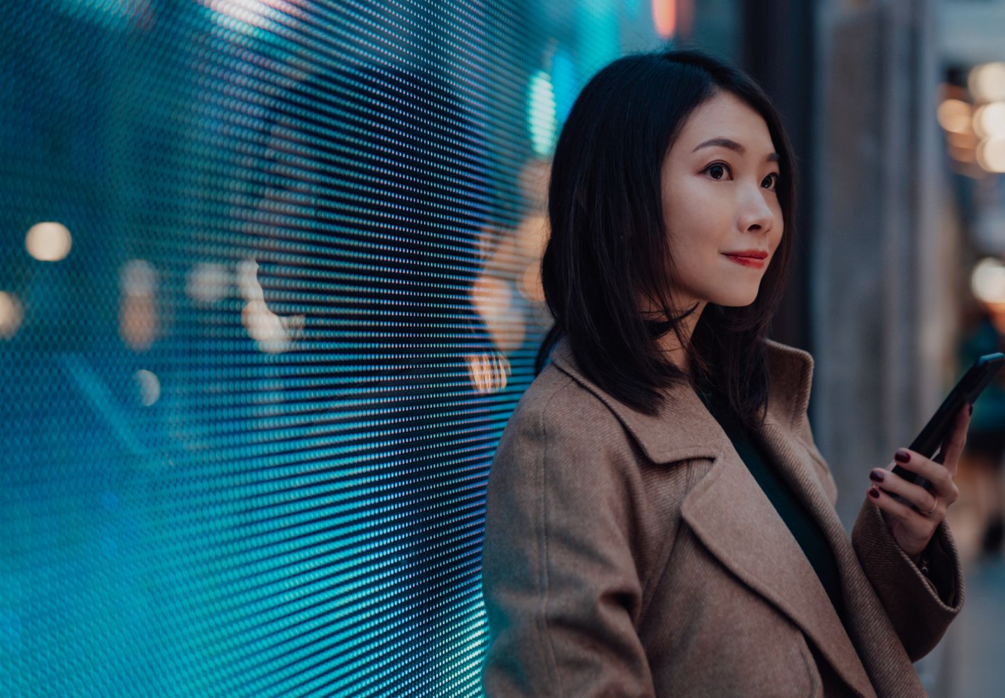 Woman standing against a window