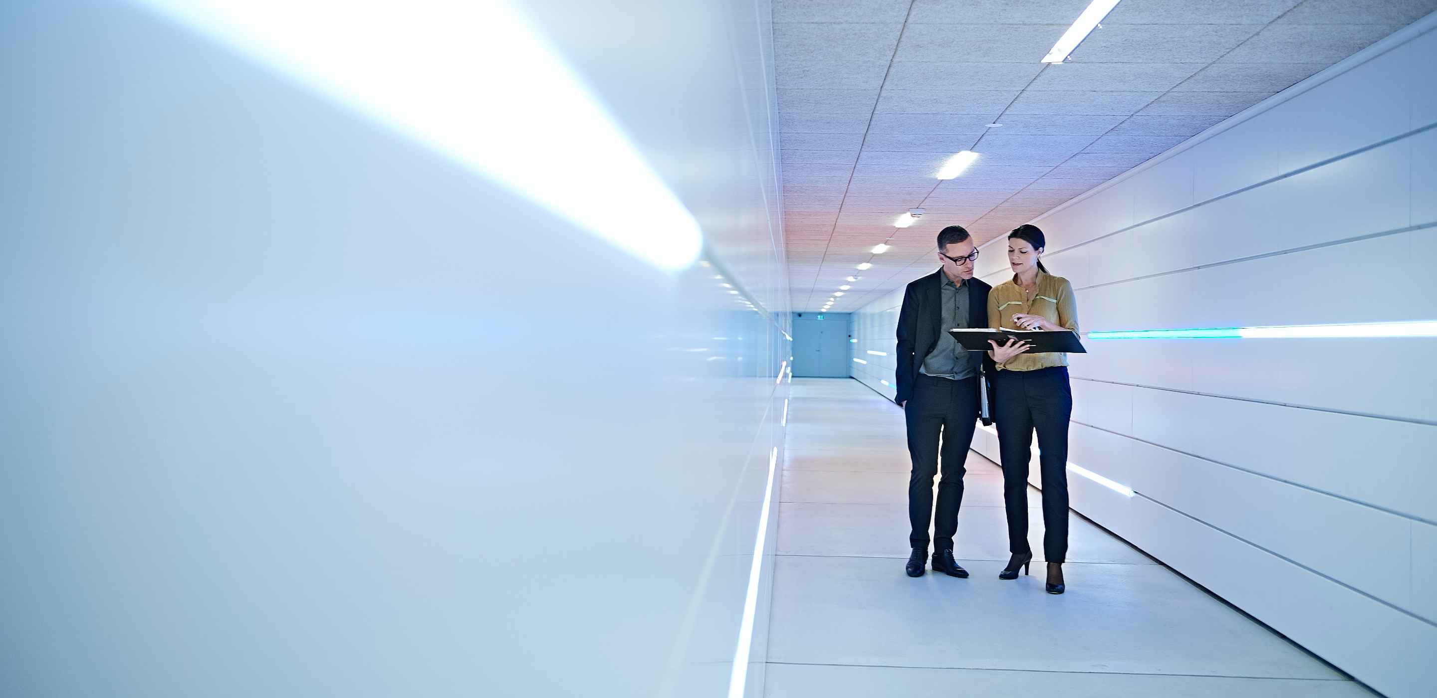 Business professional standing at the corridor