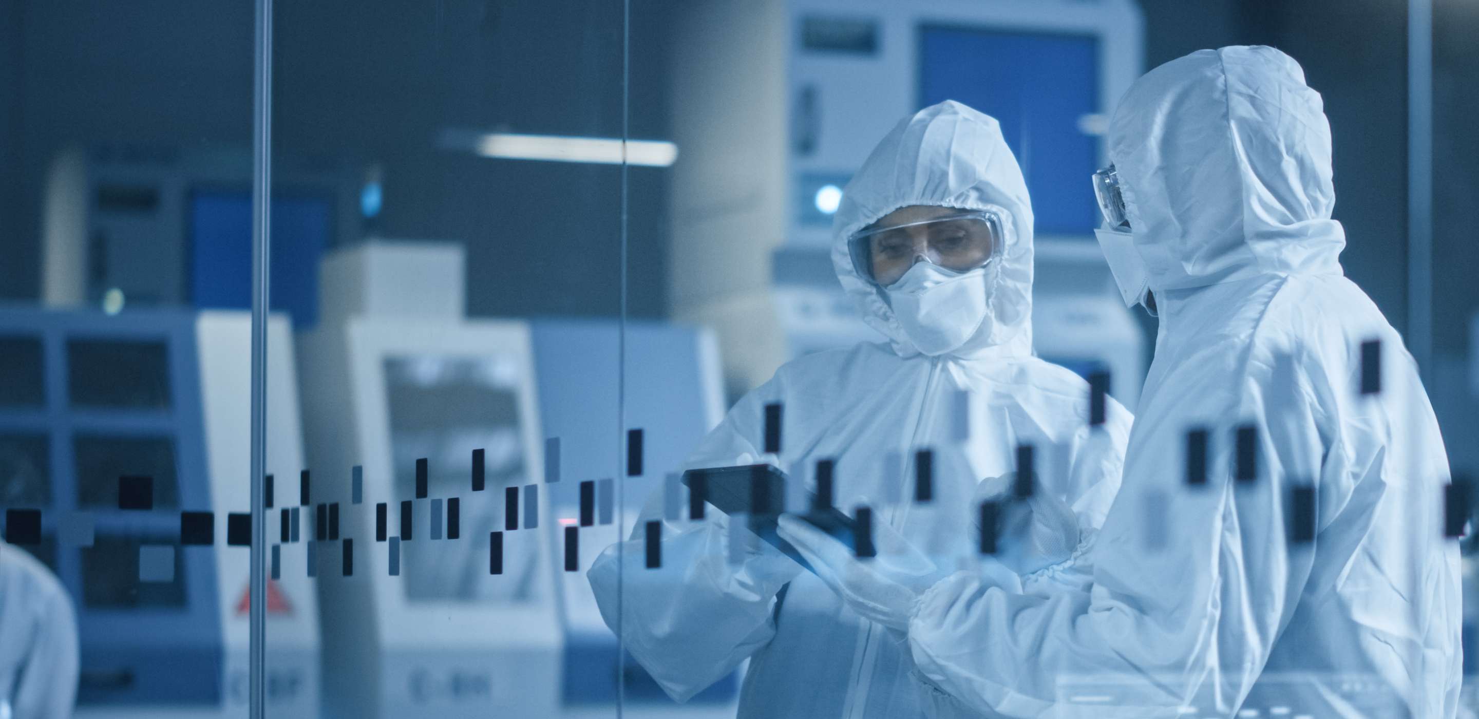 Two people wearing protective wear