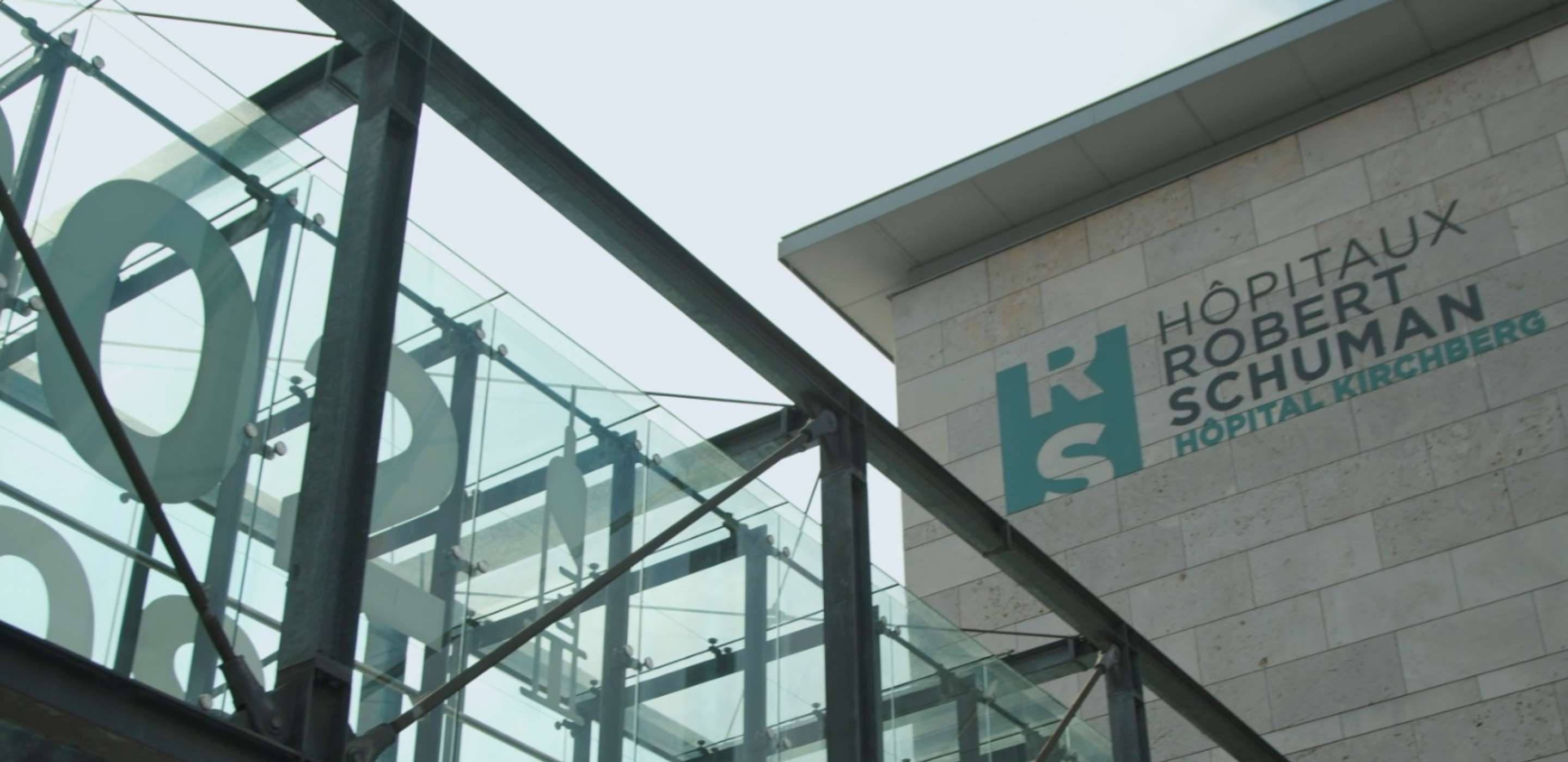 A grey building with writing