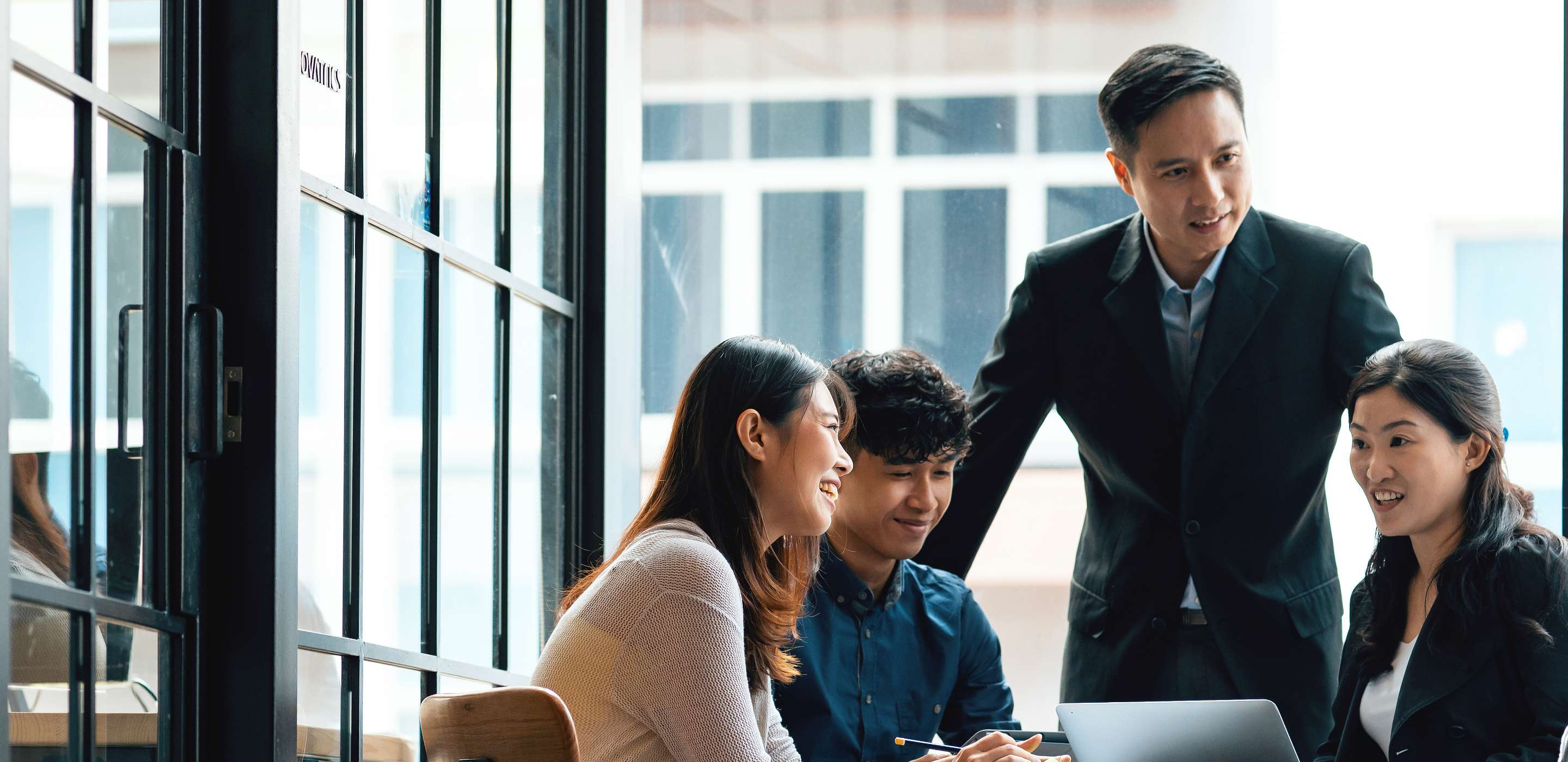 A team of people in a meeting room