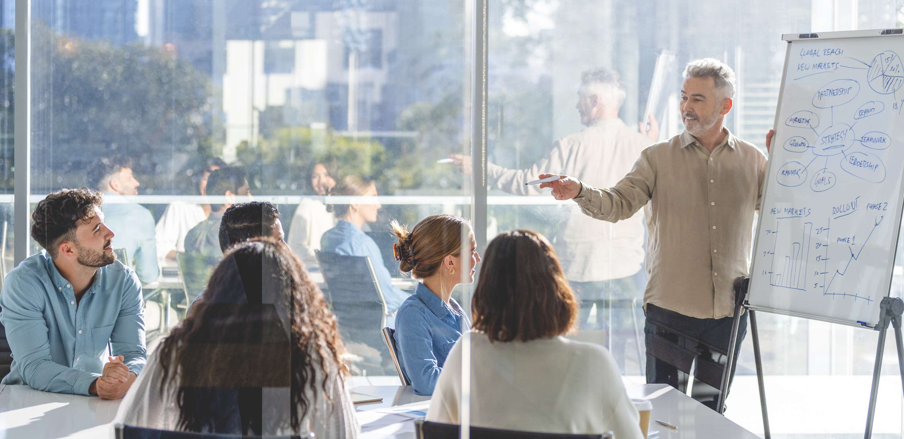 Man presenting to conference room
