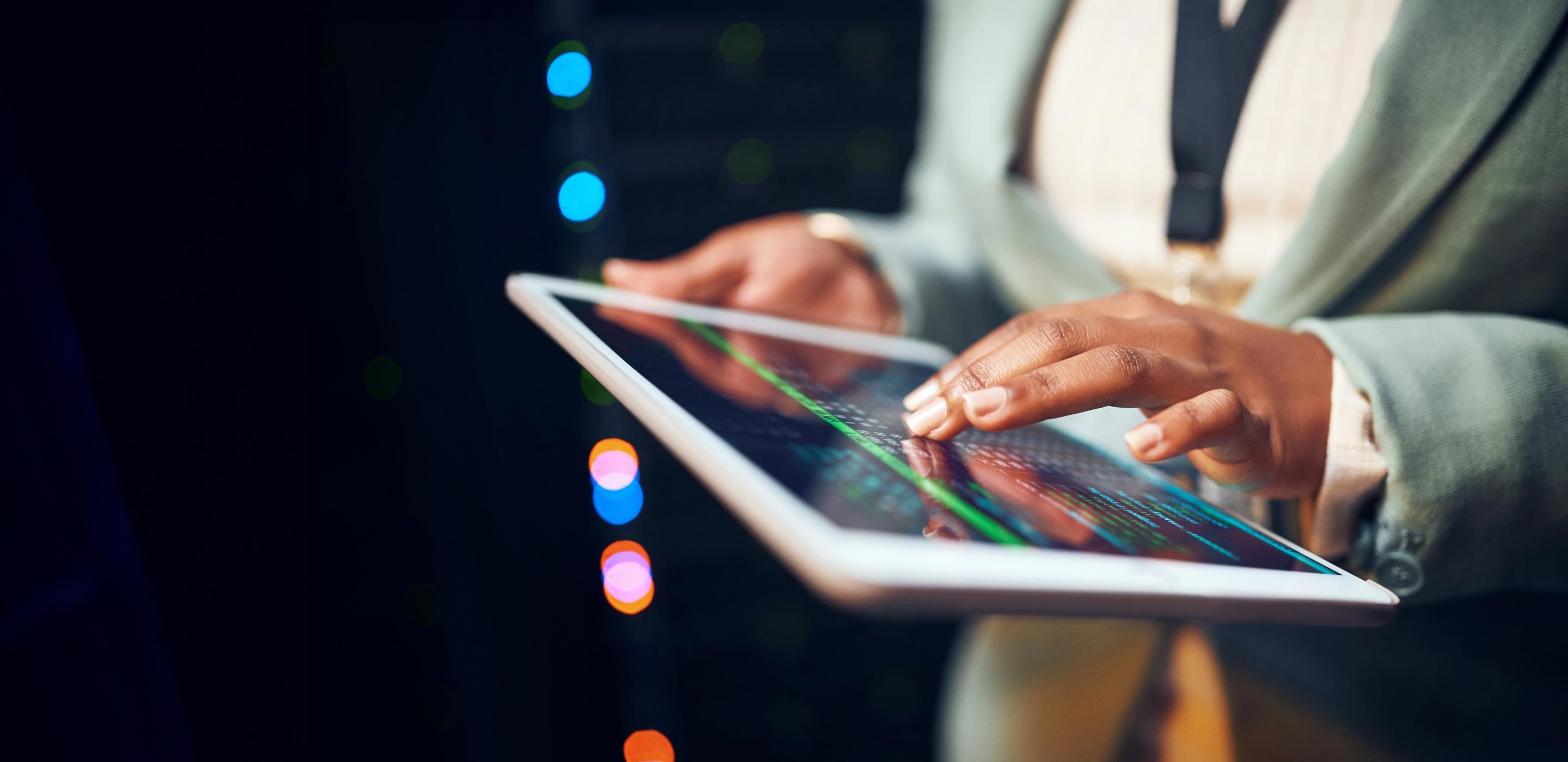 Person analyzing data on tablet device