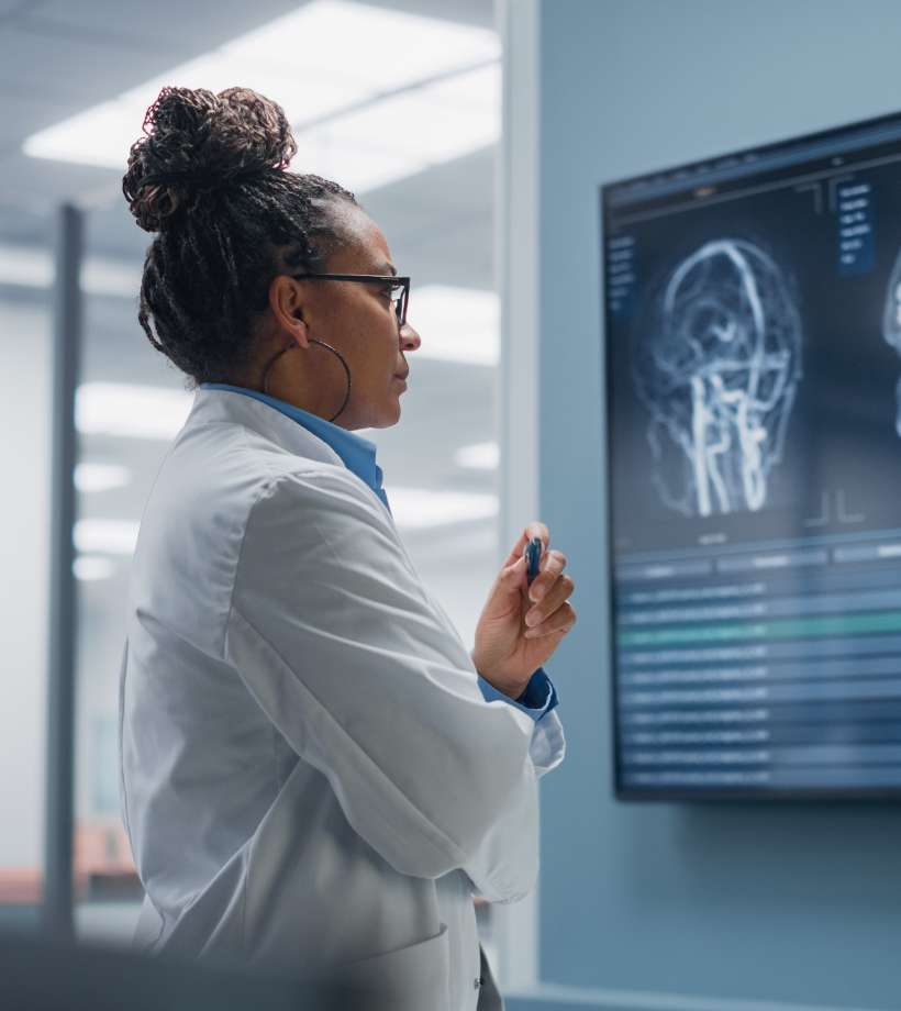 A doctor looking at the machine