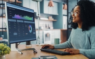 A woman looking a a screen monitor with data