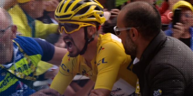 A cyclists partners pushing him on during a race