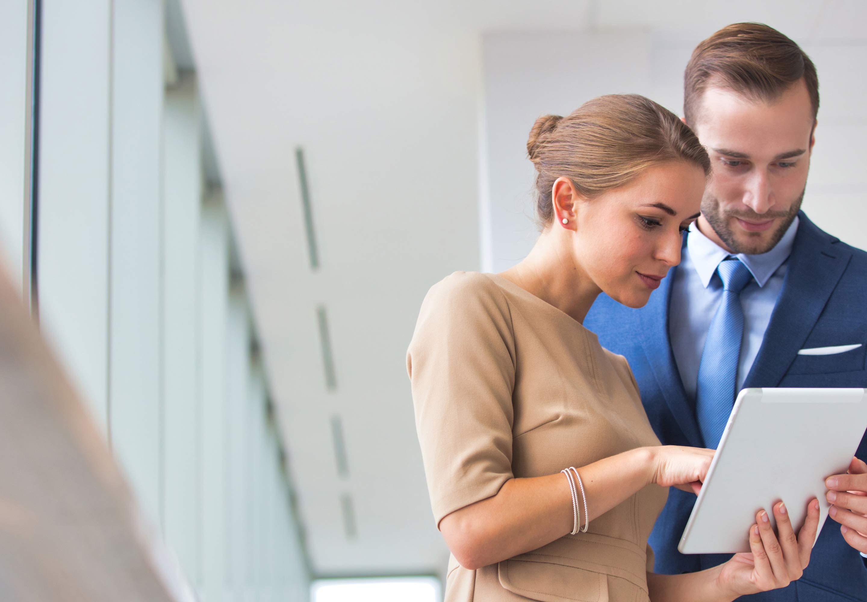 Pair going over a tablet