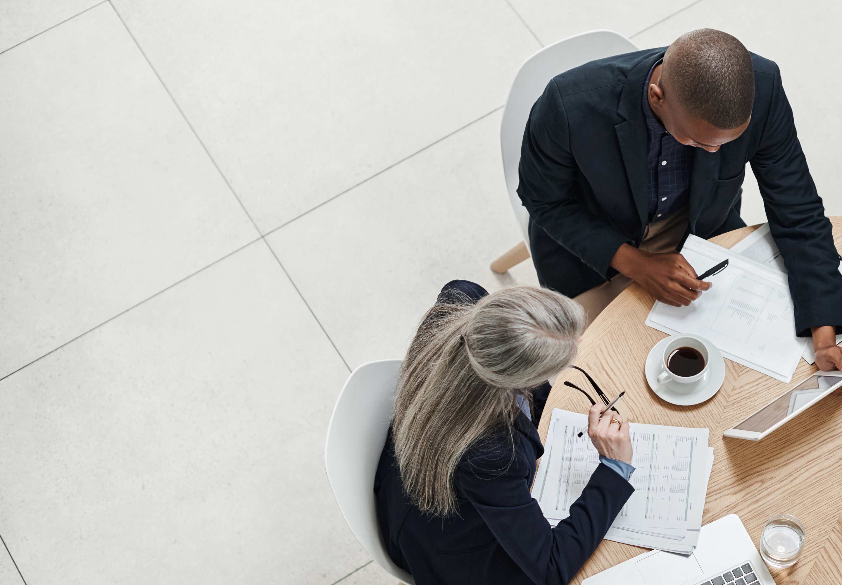 Business professionals working around the table