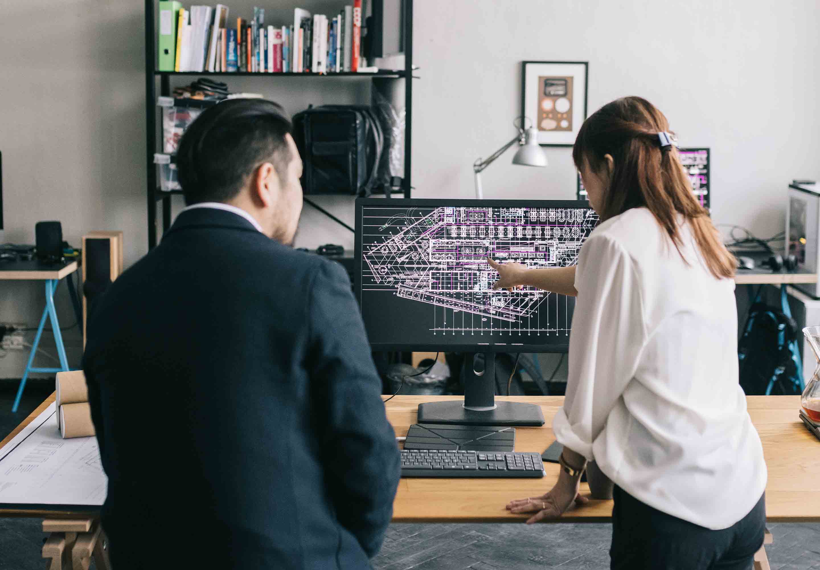 Colleagues looking on a computer screen