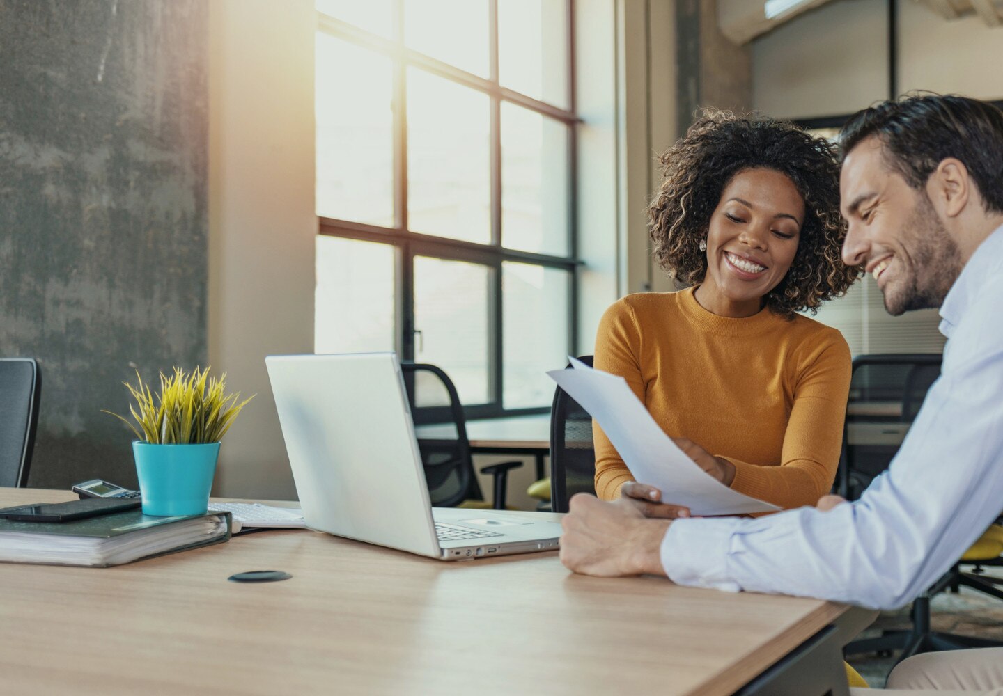 Woman and man study papers