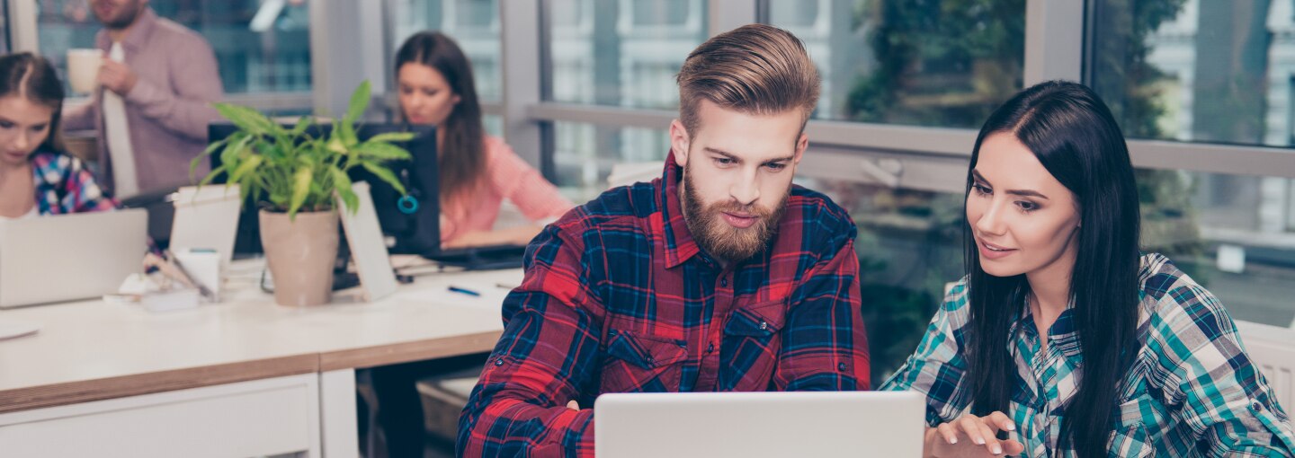 People sitting in front of a laptop