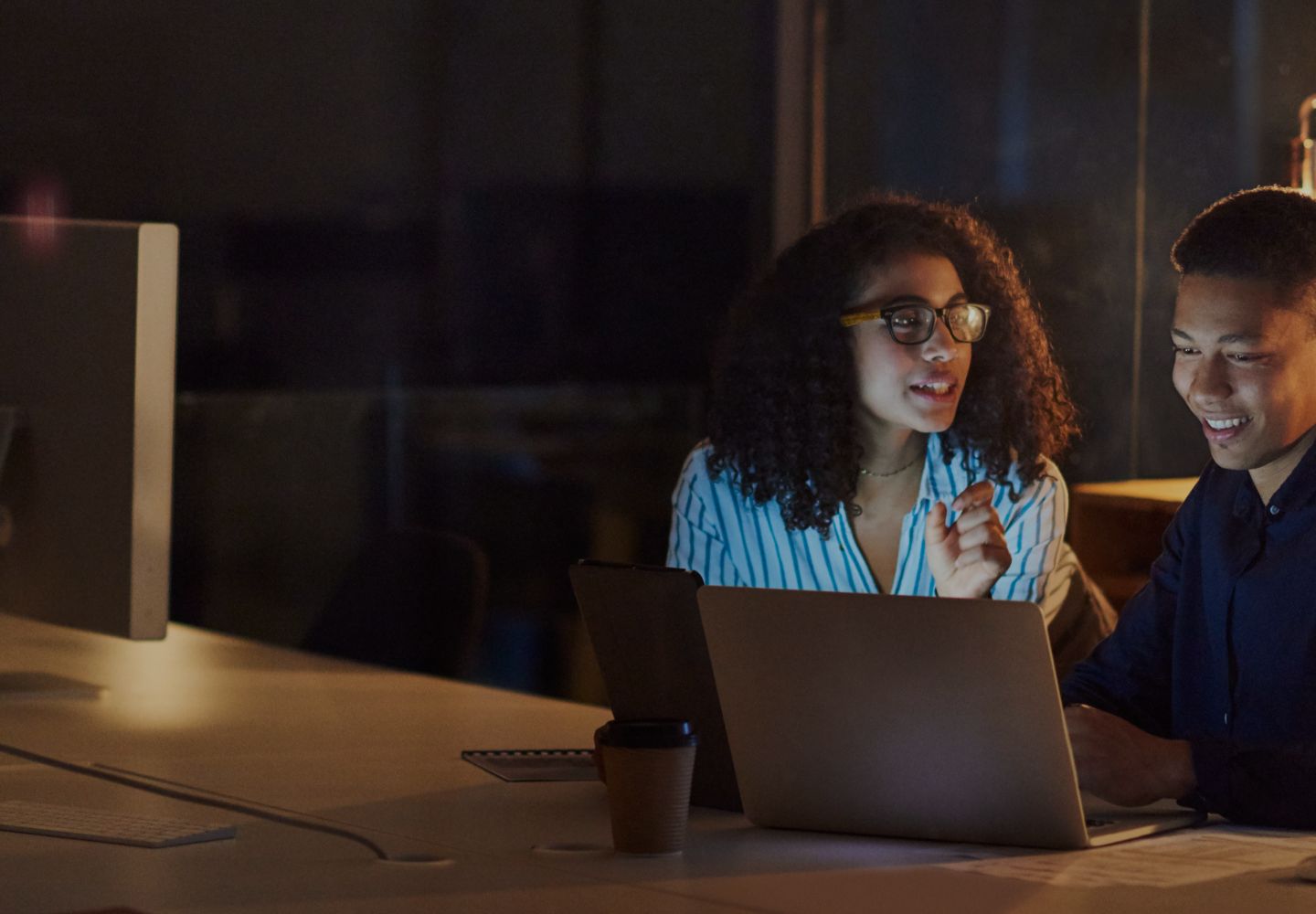 Woman and man meeting  in front of laptop
