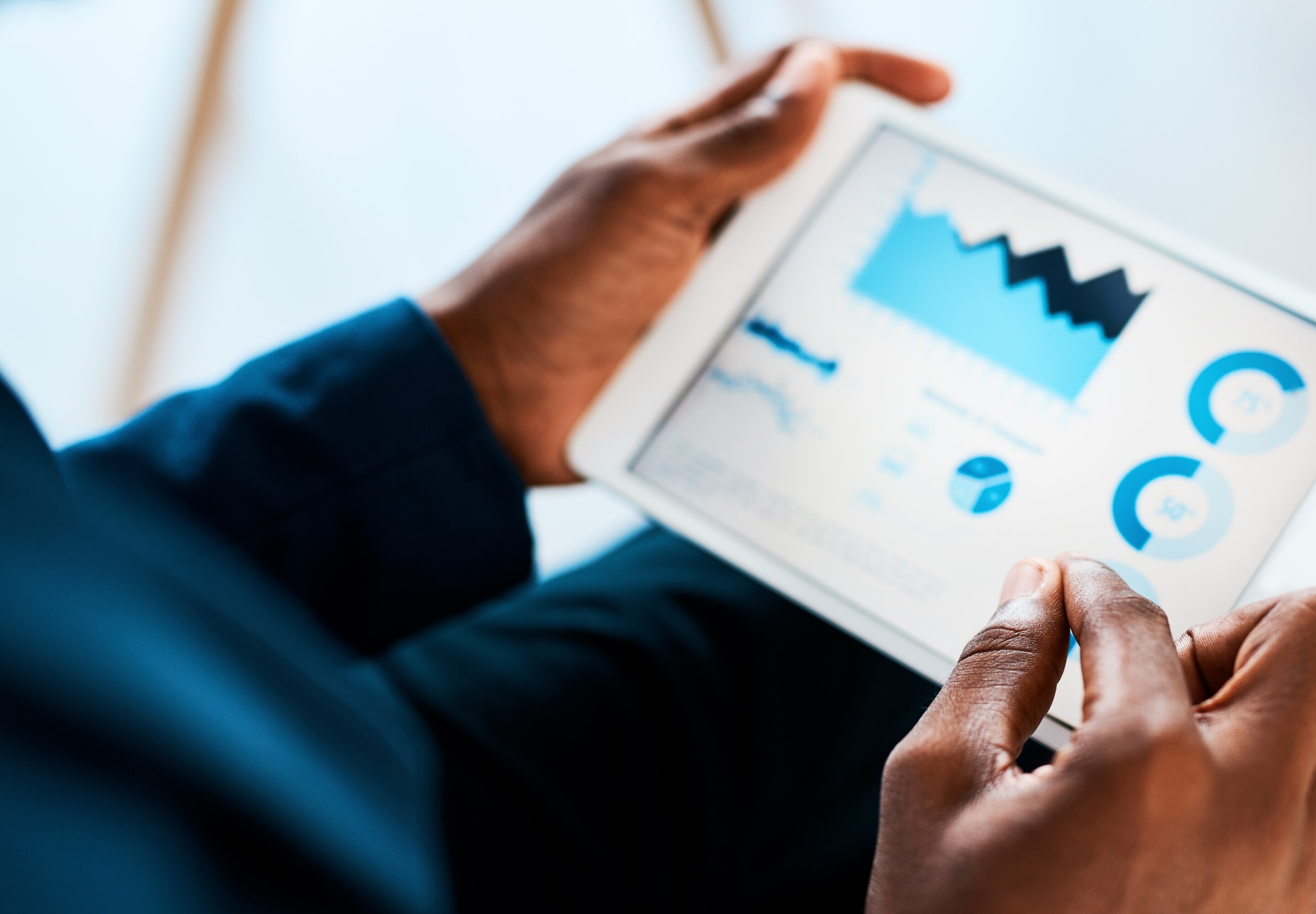 Hands holding tablet