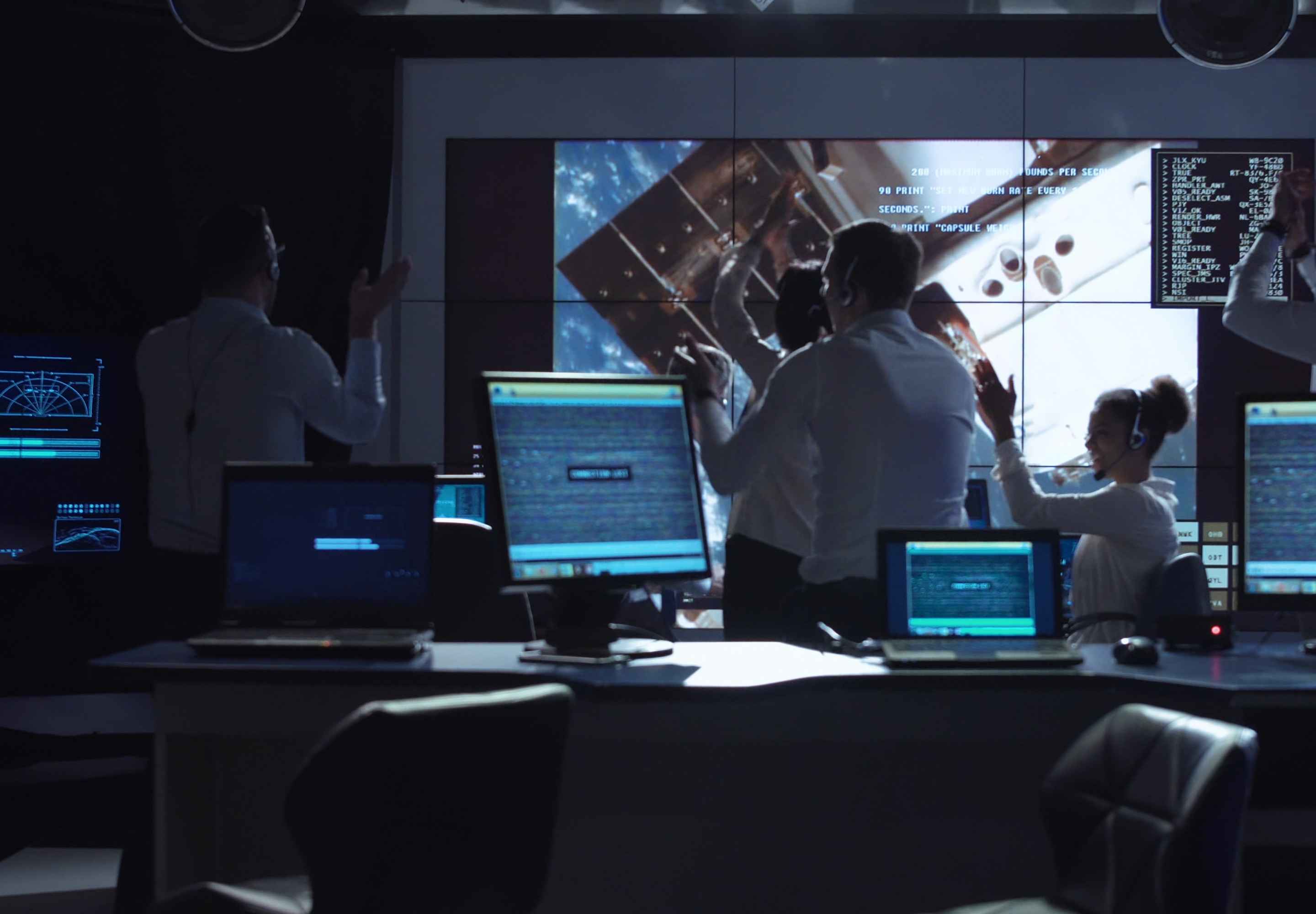 Colleagues looking a computer screens