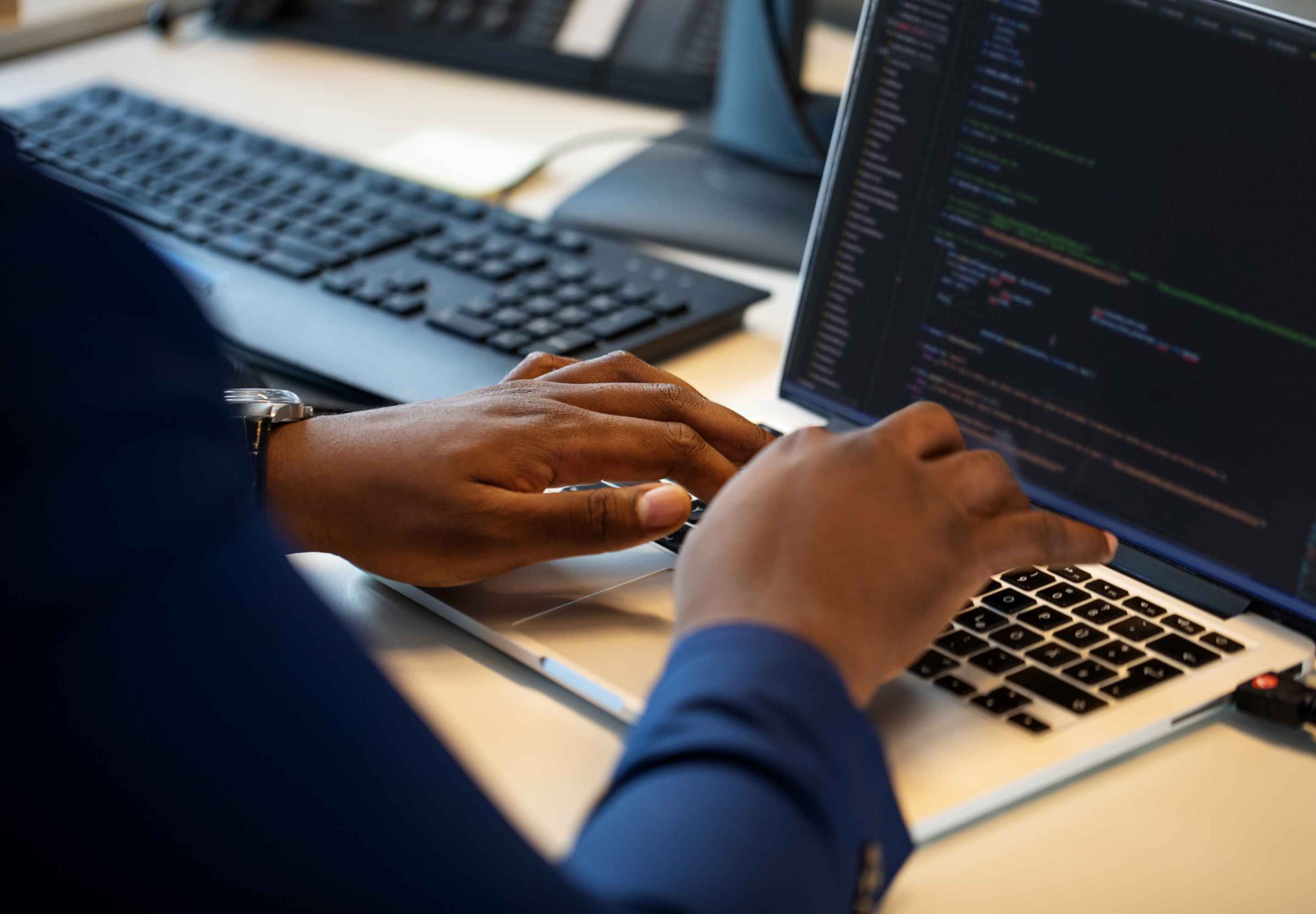 Man working with coding on computer