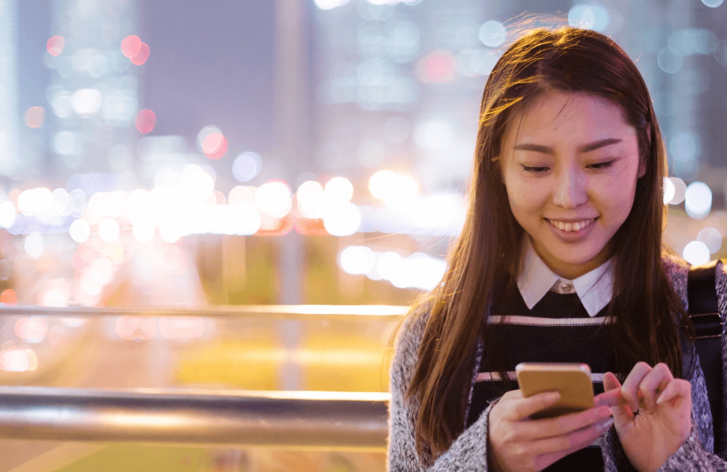 Young lady holding a mobile device