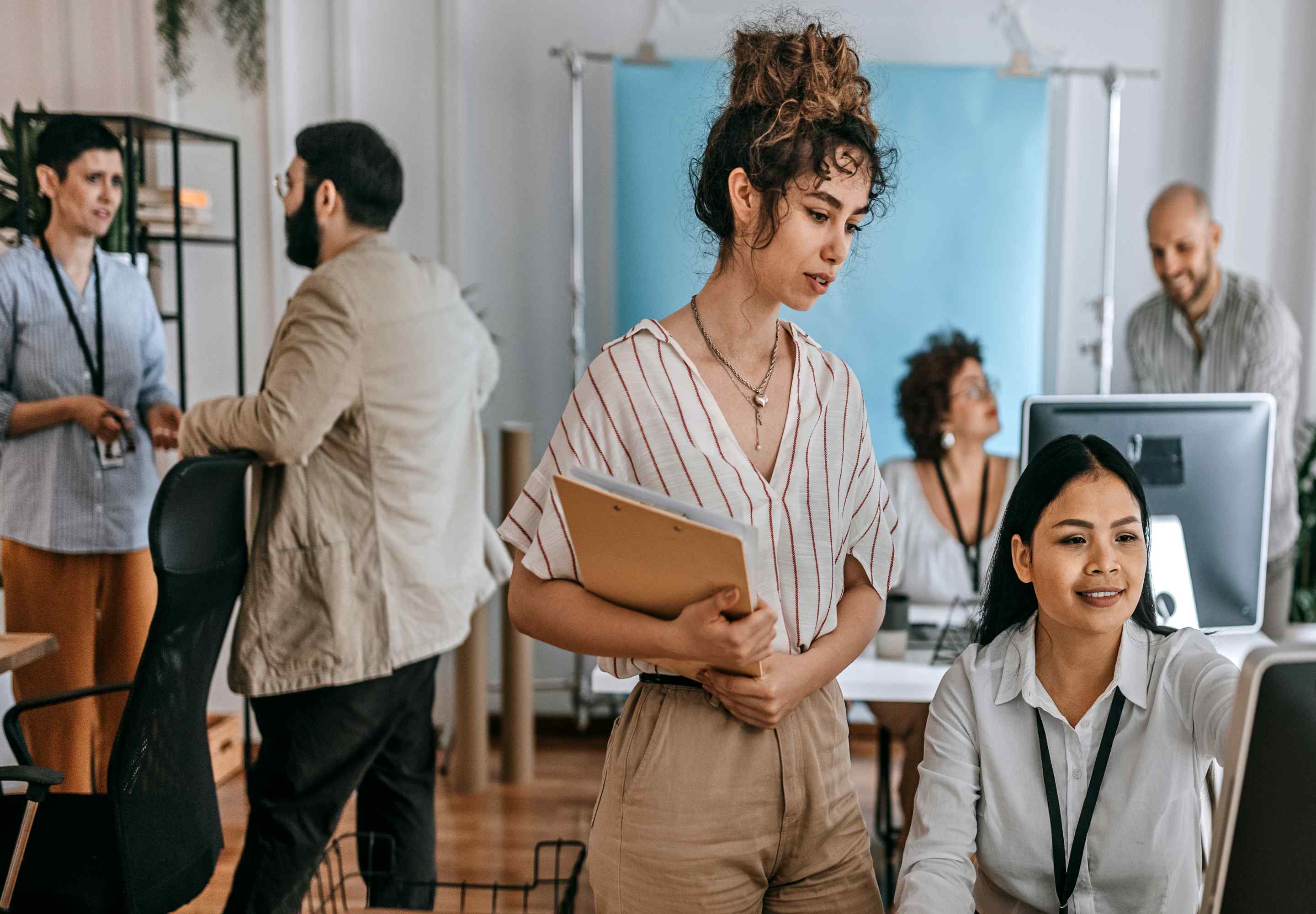 Business professionals in a open area plan