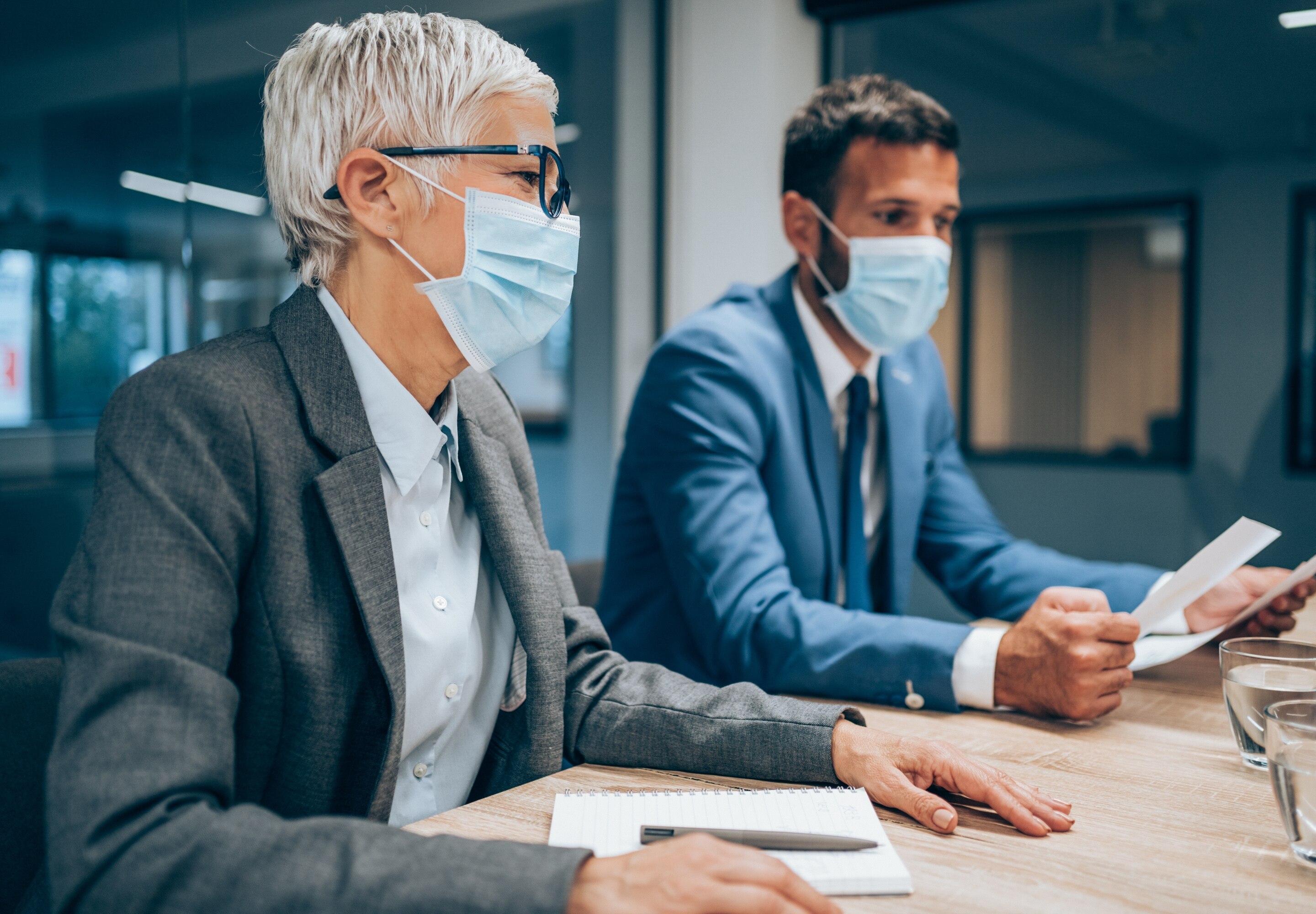 Business professionals with face masks on
