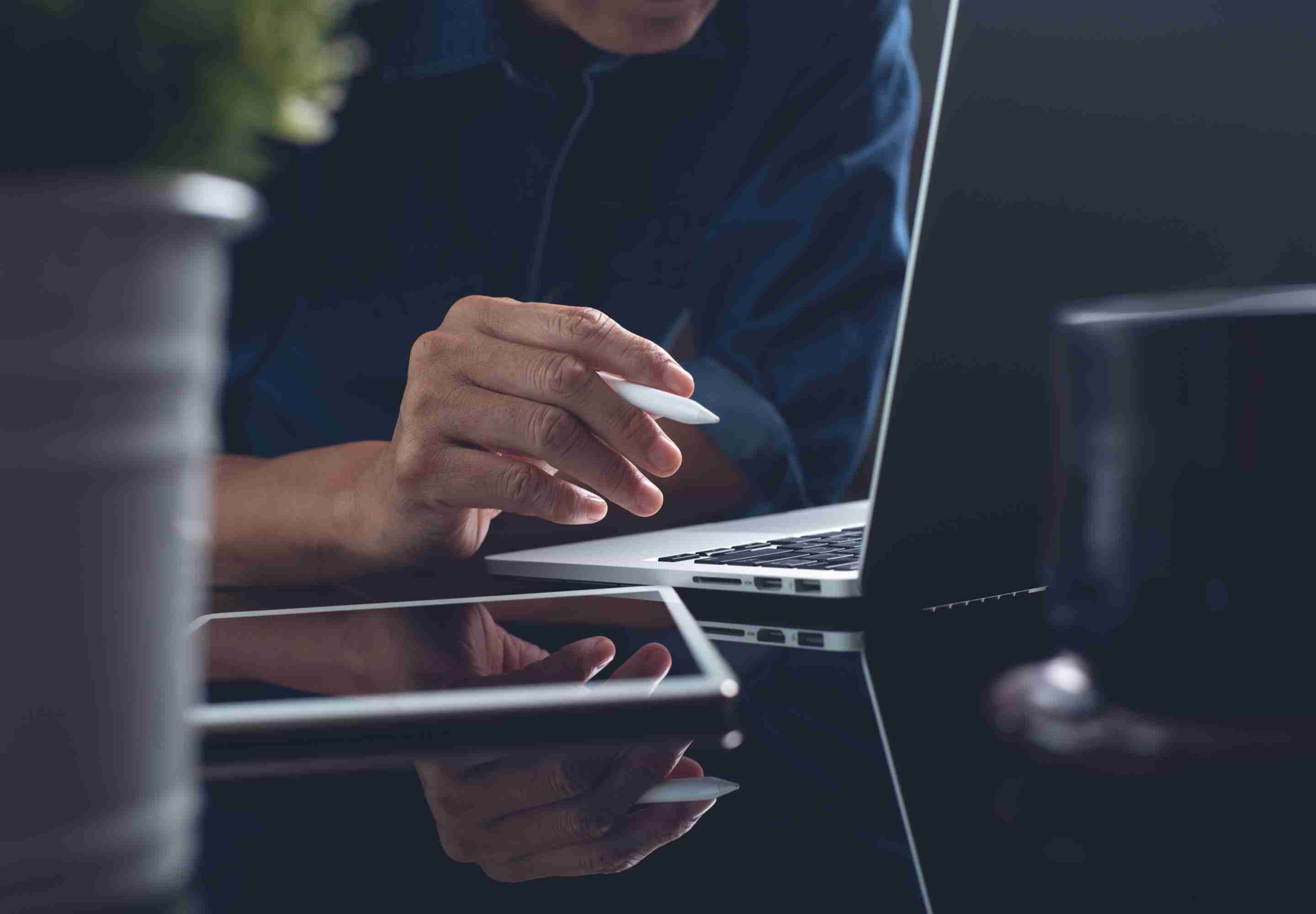 Business professional with the laptop opened