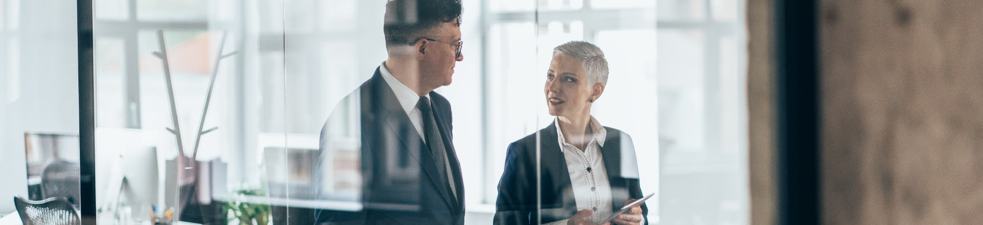 Two people talking in a corporate environment