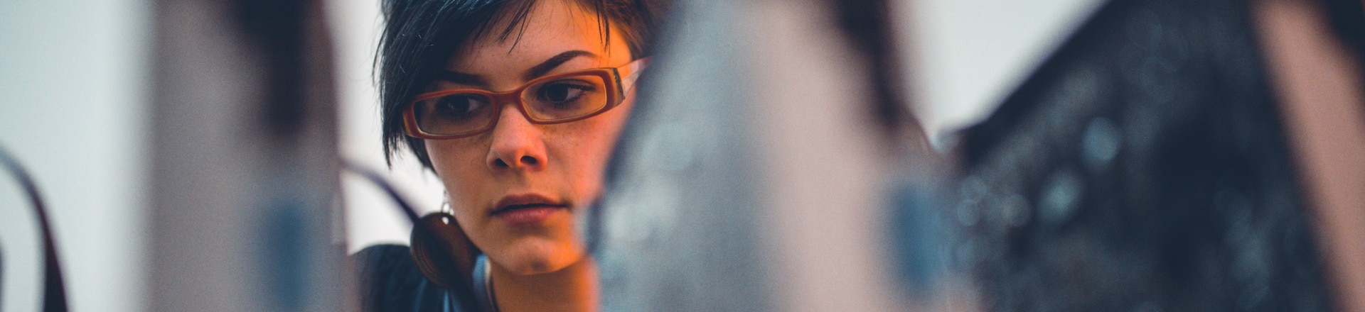Lady wearing glasses looking at the computer screen