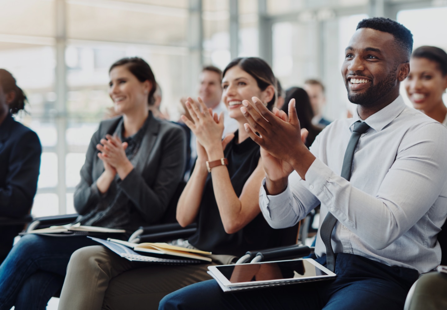 Colleagues clapping hands