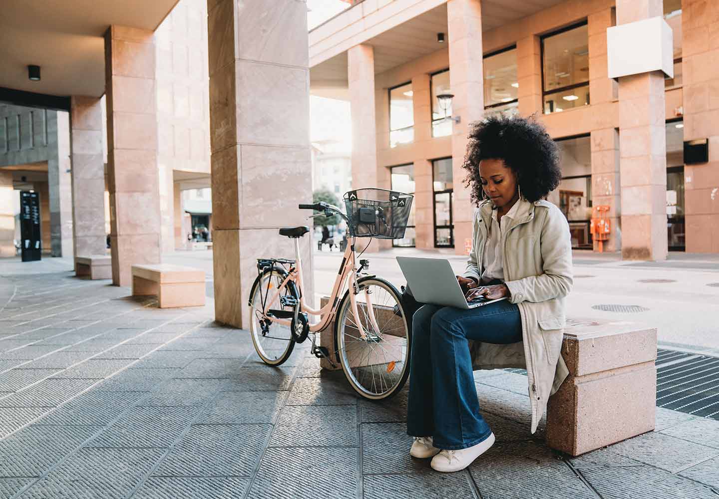A lady with laptop on her lap