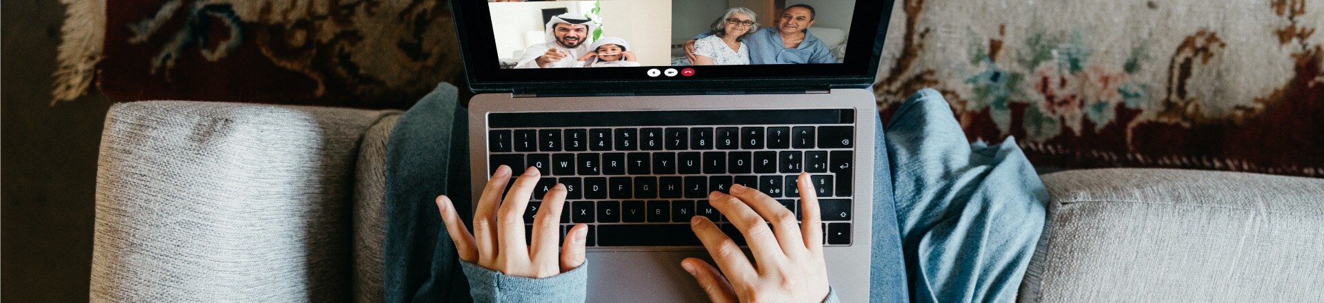 A person typing on their laptop