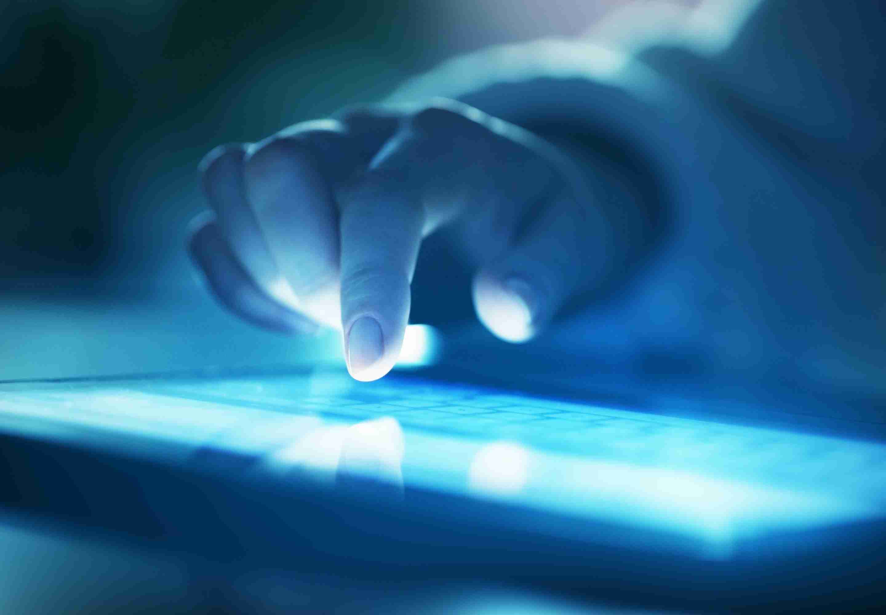 Business professional touching the tablet screen
