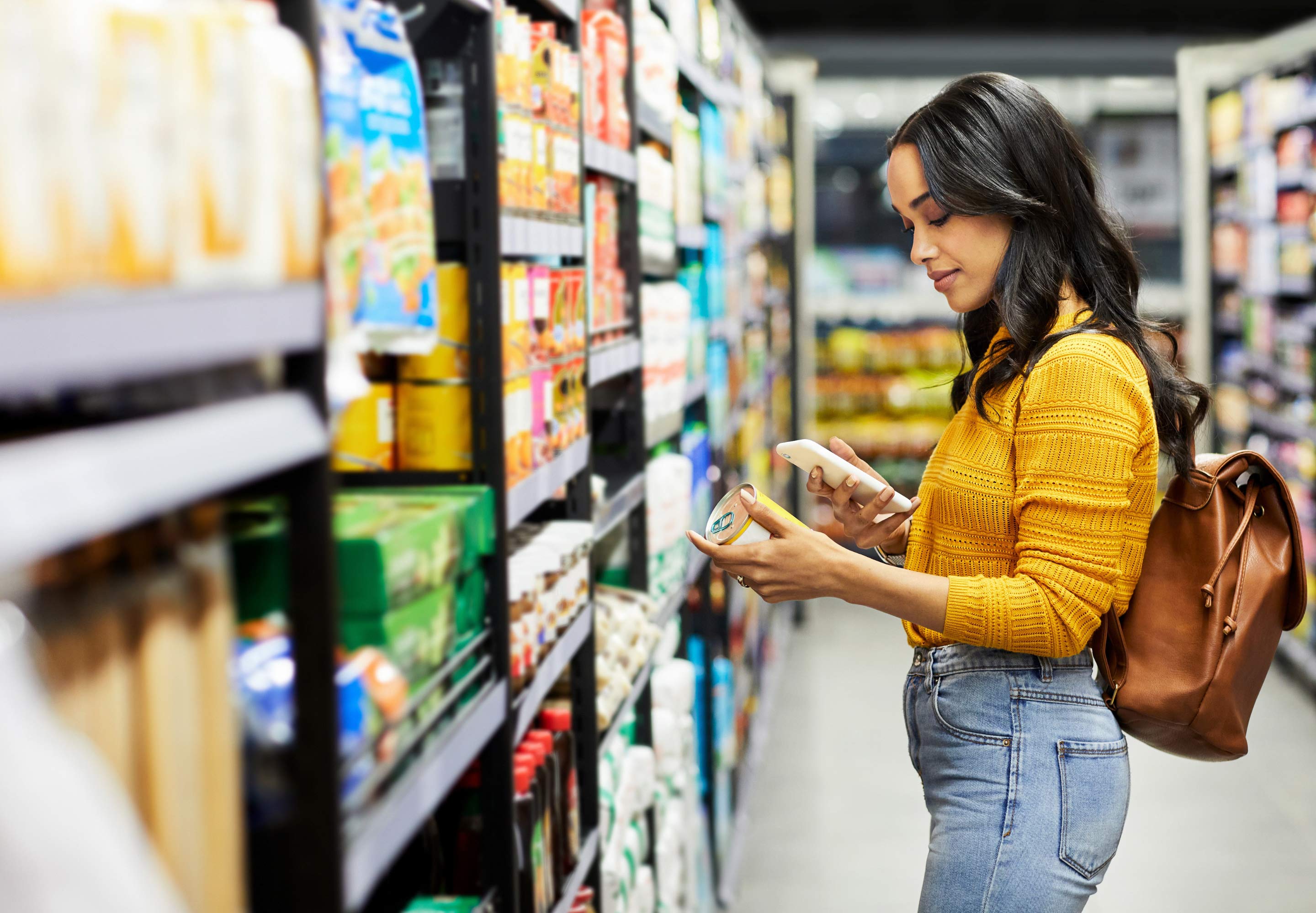 Woman looking at products in her hand