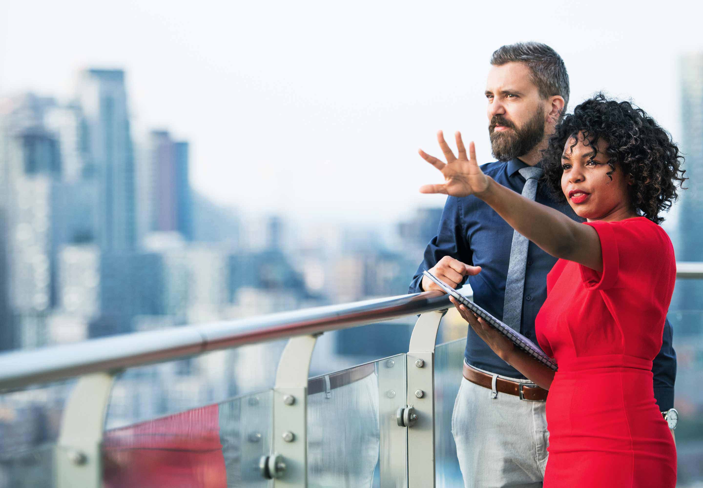 Lady in a red dress standing in outside