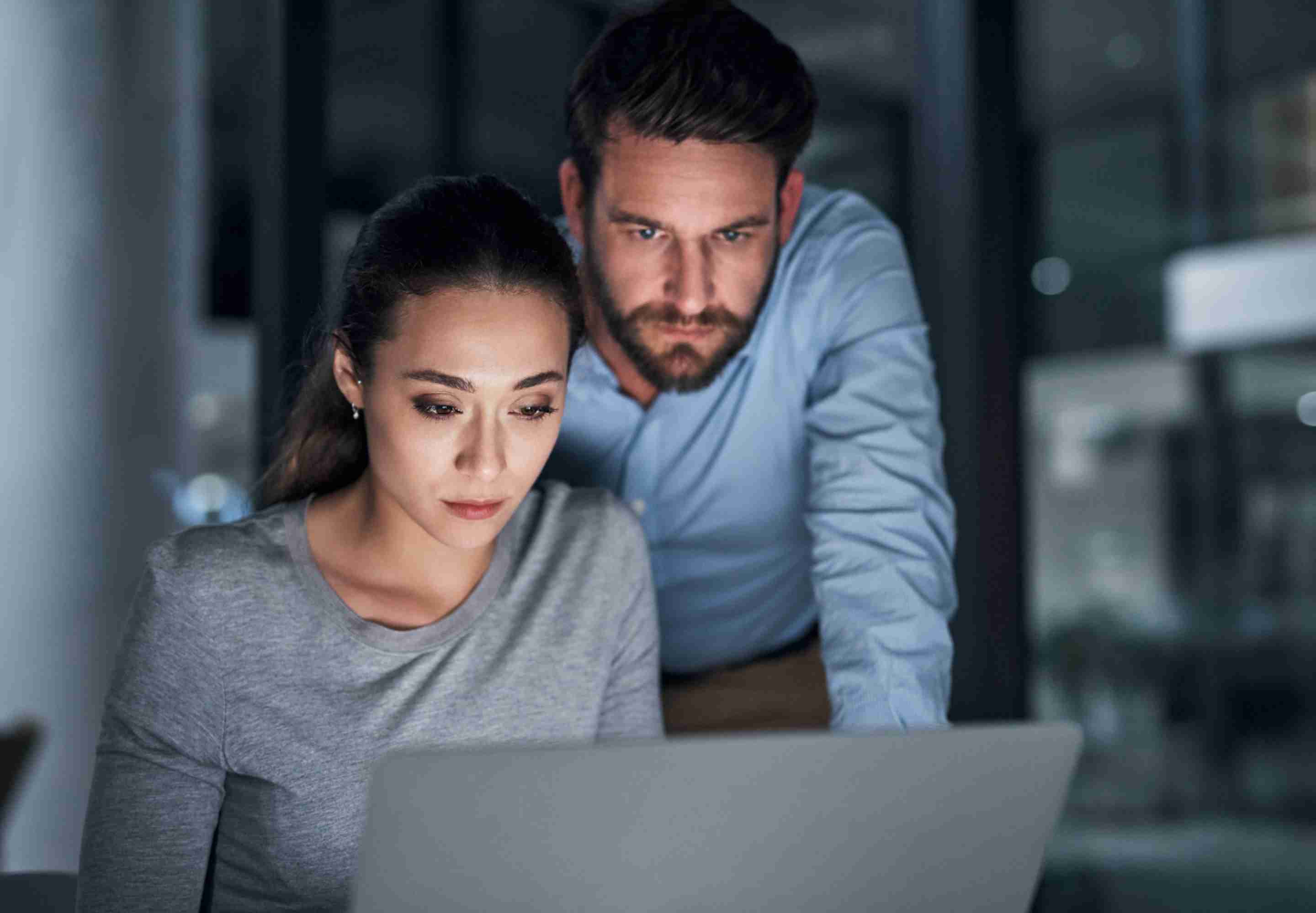 Woman and man study laptop