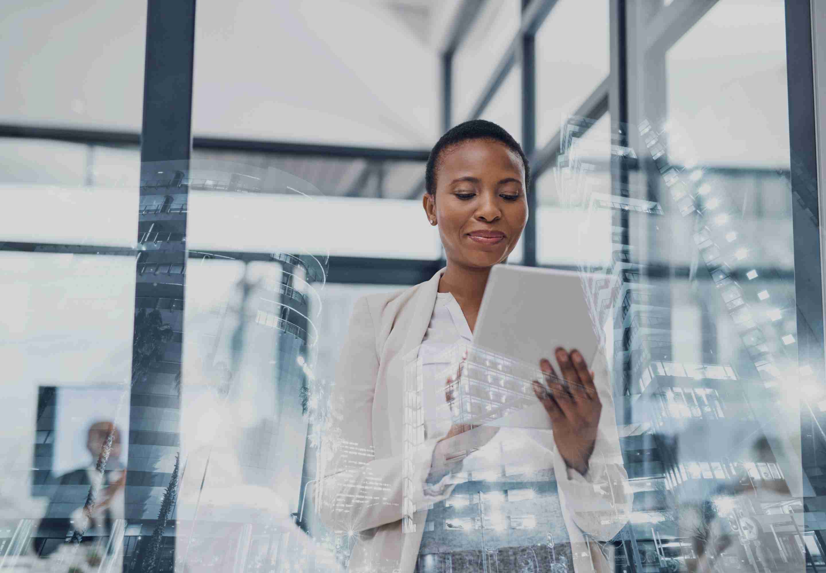 Woman in office studies tablet