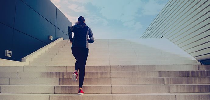 Athlete running up the stairs