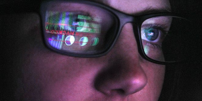 Spectacles reflecting a computer screen