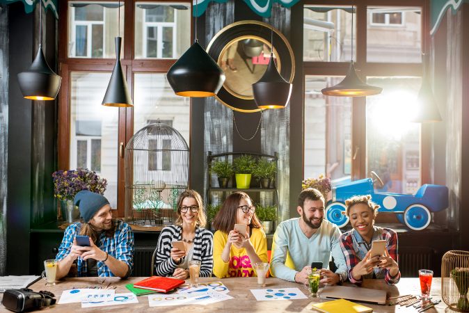 Group of people sitting at a table collaborating