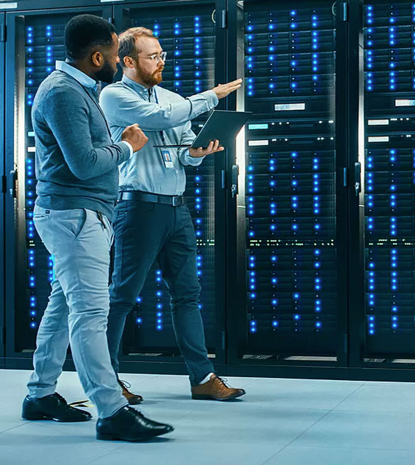 Two colleagues in a data center
