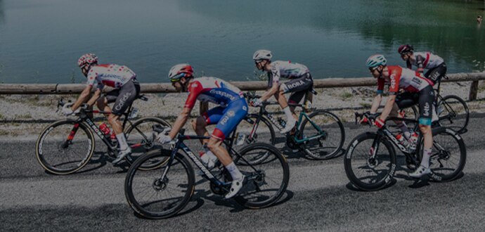 Bike racers on a bridge