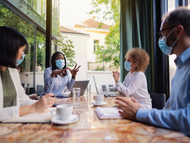 Business professionals with masks on