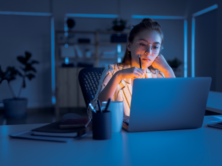 A person working from home in dim light