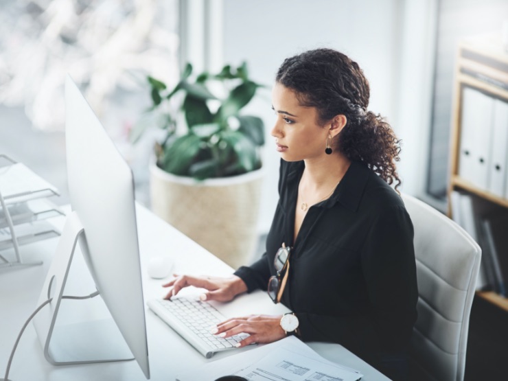 A woman working on her computer while at home