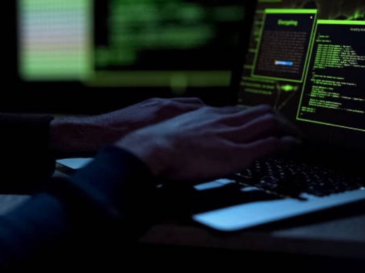 Hands poised over a computer keyboard