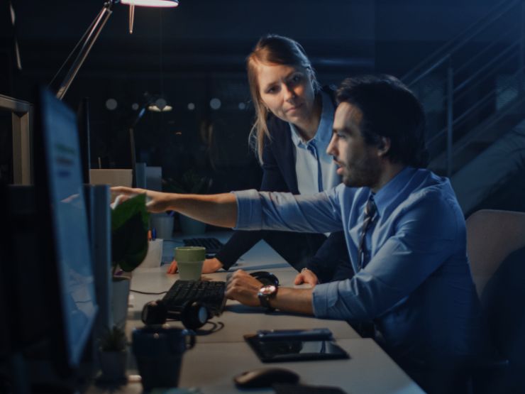 Man point to computer screen