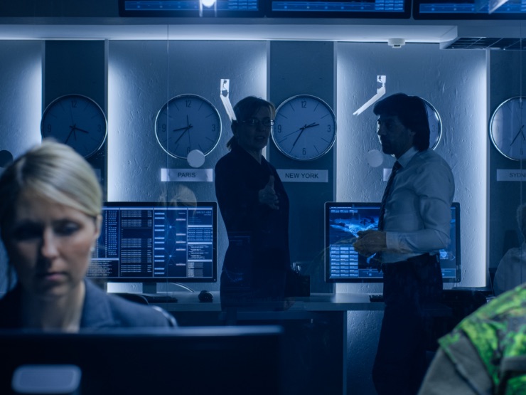 People in a room being proactive about security