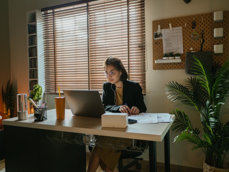 A woman working from her home desk