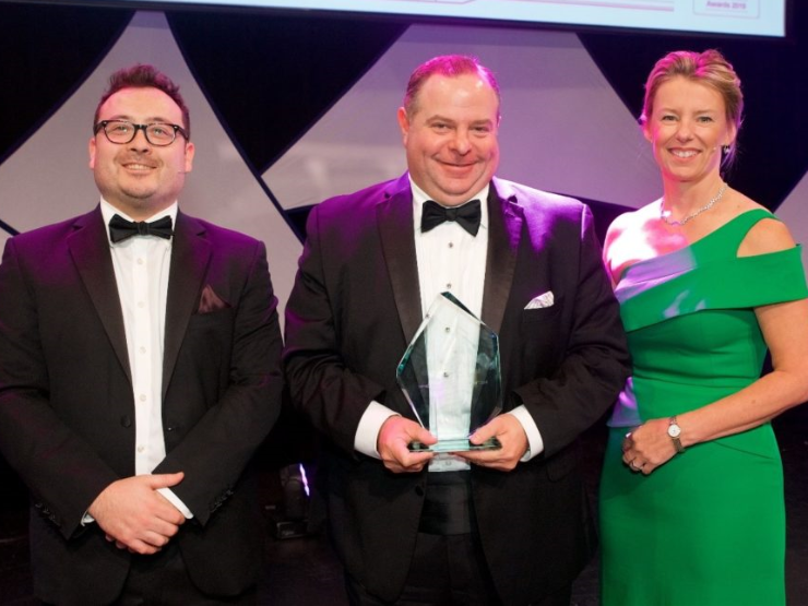 Business professionals receiving awards