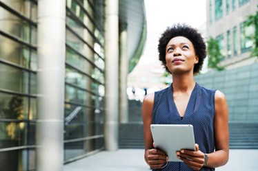 A woman holding a tablet