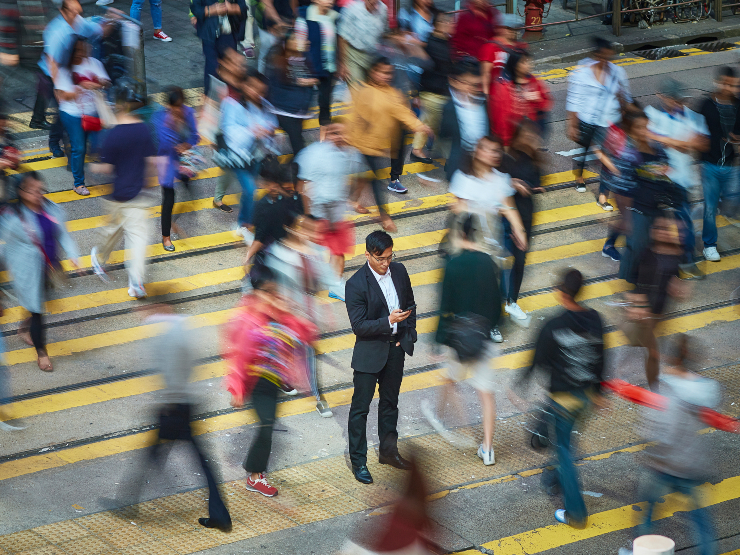 People crossing a busy street
