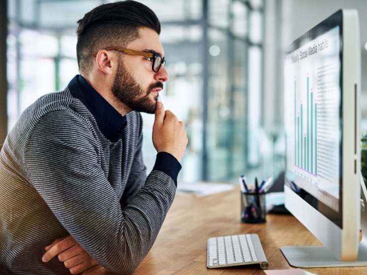 Professional looking at a computer screen