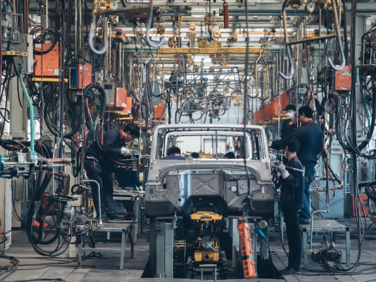 A car in a factory workshop setting